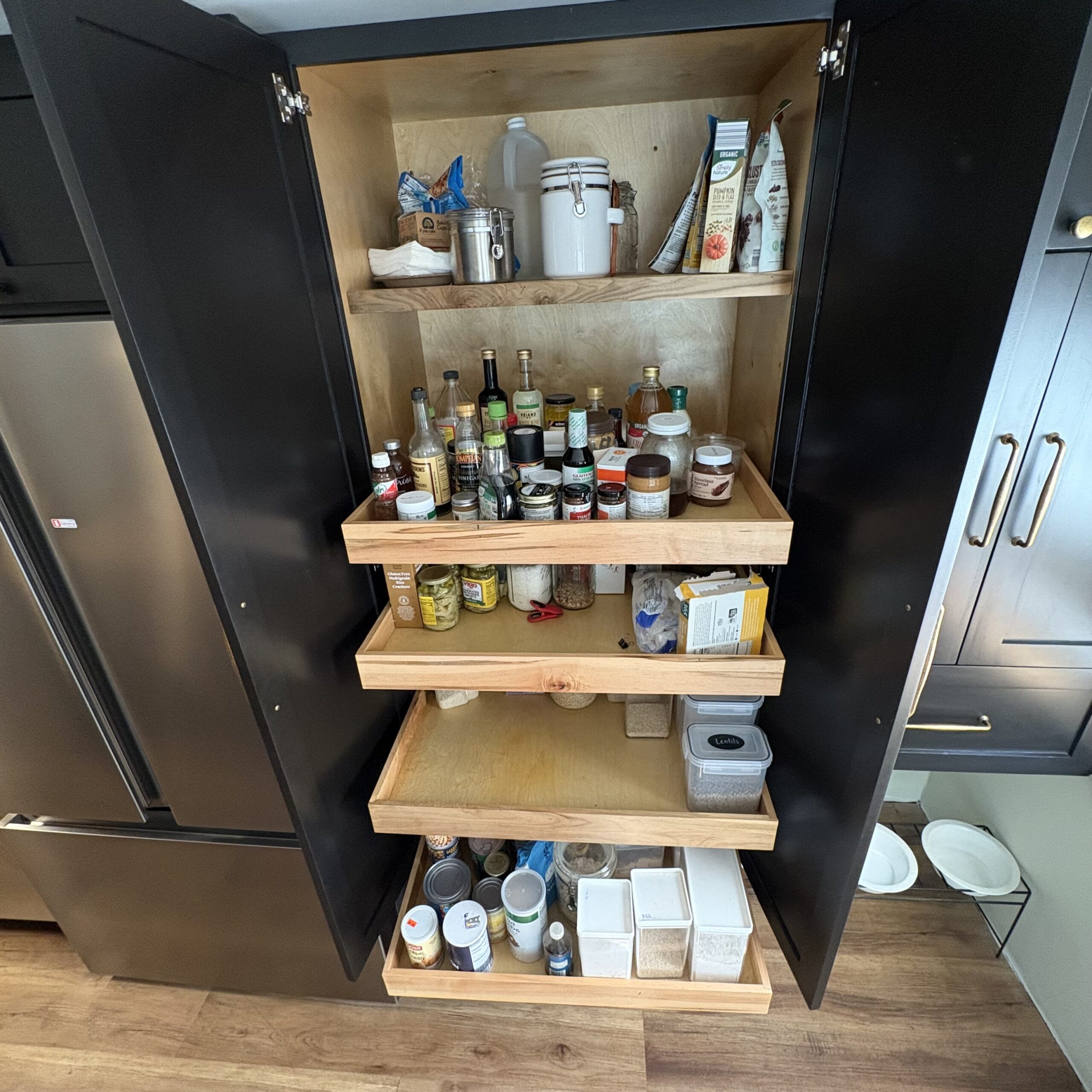 custom cabinetry pantry with sliding drawers